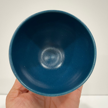 Load image into Gallery viewer, Hand holding a small pottery bowl showing the blue interior.
