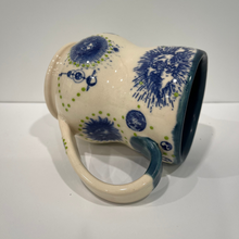 Load image into Gallery viewer, Ceramic mug with blue floral patterns on a white background