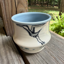 Load image into Gallery viewer, The crane matcha pottery cup has a lovely hand painted crane and bullseye design and is lined in a soft blue.