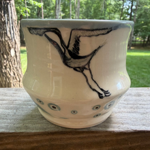 Load image into Gallery viewer, Small white pottery cup designed for drinking matcha graced with a hand painted crane.