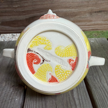 Load image into Gallery viewer, Pottery bowl laying on its side with handles