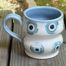 Load image into Gallery viewer, Ceramic mug with blue and white pattern on a wooden surface