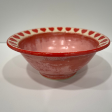 Load image into Gallery viewer, Pink Pottery Bowl with red hearts carved around a beige rim.