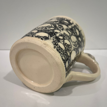Load image into Gallery viewer, Ceramic mug with black skull pattern on a white background