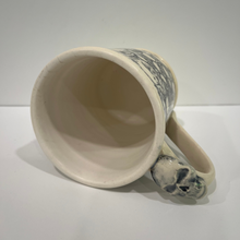 Load image into Gallery viewer, View of inside of skull pottery mug 4.