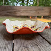 Load image into Gallery viewer, Decorative ceramic bowl with floral patterns on a wooden surface outdoors