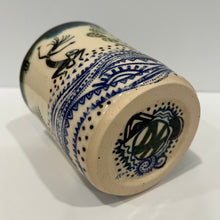 Load image into Gallery viewer, Bottom of kokopelli pottery mug
