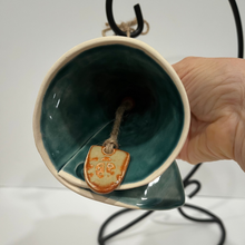 Load image into Gallery viewer, Bottom of Angel Tree Bell with clay piece on a jute string to make the bell ring
