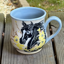 Load image into Gallery viewer, Ceramic mug with horse design on a wooden surface
