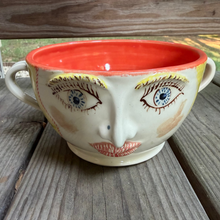 Load image into Gallery viewer, Ceramic bowl with face design on a wooden surface
