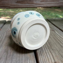 Load image into Gallery viewer, Ceramic jar with blue circular patterns on a wooden surface
