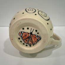 Load image into Gallery viewer, Ceramic mug with butterfly design on a white background
