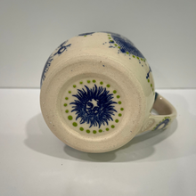 Load image into Gallery viewer, Ceramic mug with blue and green floral design on a white background
