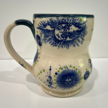 Load image into Gallery viewer, Ceramic mug with blue floral patterns on a white background
