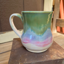Load image into Gallery viewer, Multicolored ceramic mug on a metal surface
