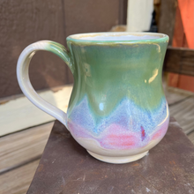 Load image into Gallery viewer, Ceramic mug with a gradient design on a wooden surface
