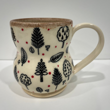 Load image into Gallery viewer, Ceramic mug with nature-themed pattern on a white background
