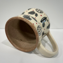 Load image into Gallery viewer, Ceramic mug with leaf pattern on a white background

