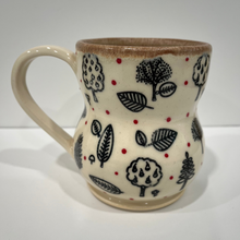 Load image into Gallery viewer, Ceramic mug with nature-themed design on a white background

