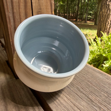Load image into Gallery viewer, Blue ceramic pot on a wooden deck with a forest background
