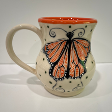 Load image into Gallery viewer, Ceramic mug with butterfly design on a white background
