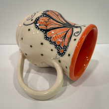 Load image into Gallery viewer, Ceramic mug with butterfly design on a white background

