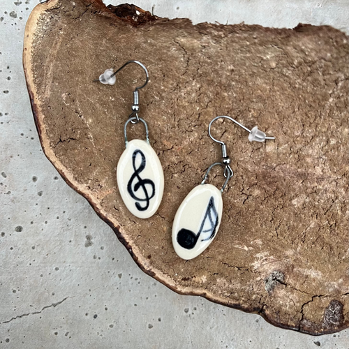 Musical Notes Earrings on a mushroom background
