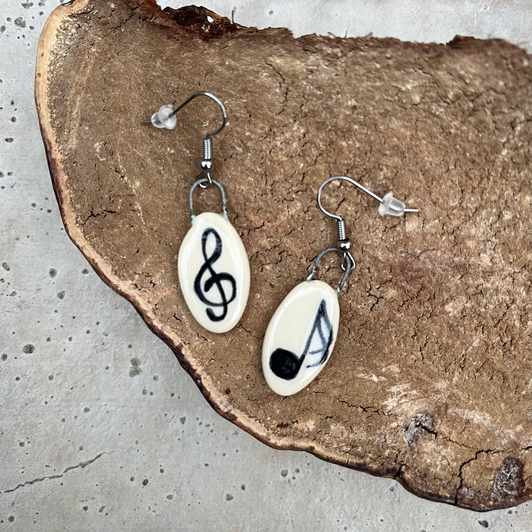 Musical Notes Earrings on a mushroom background