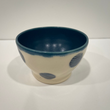 Load image into Gallery viewer, Little white pottery bowl with blue polka dots and blue interior.
