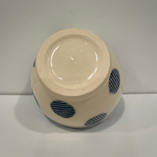 Load image into Gallery viewer, Little pottery bowl upside down and showing blue polka dots on the sides.
