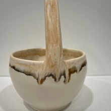 Load image into Gallery viewer, Pottery basket with beige handle brown rim and white body.
