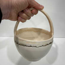 Load image into Gallery viewer, Hand holding a pottery basket
