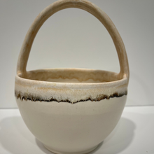 Load image into Gallery viewer, White pottery bowl with beige handle.
