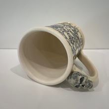 Load image into Gallery viewer, Ceramic mug with decorative handle on a white background
