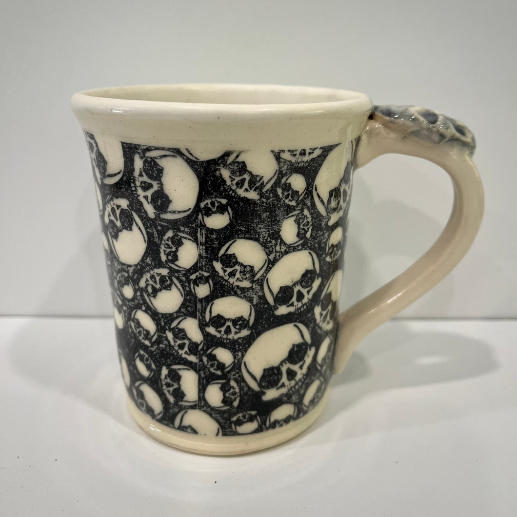 Pottery Mug with skull underglaze transfer.