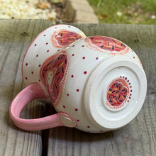 Load image into Gallery viewer, Check out the surprise pink sprinkle donut on the bottom of this handmade pottery mug.

