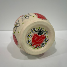 Load image into Gallery viewer, Strawberry and flowers on bottom of strawberry pottery mug
